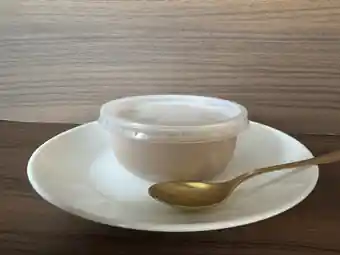 SILKOA 150 g chilled cup served on a plate with a spoon